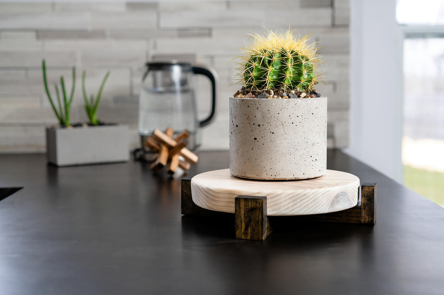 Image showcasing a rustic farmhouse plant stand, skillfully handcrafted from solid Pine wood. The flat stand, stained and finished with natural Hard wax Oil, is ready to hold a variety of plant pots or home decorations, demonstrating its versatile functionality.