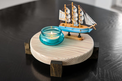 Close-up photograph of a rustic, farmhouse-style plant stand made from solid Pine wood. Displaying the stand's detailed grain and Hard wax Oil finish, it perfectly illustrates its capability to accommodate a variety of pots or decorative items.